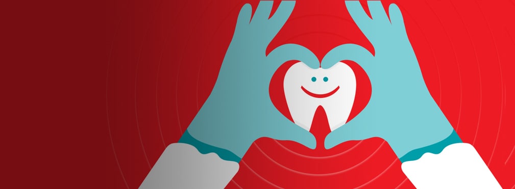 hands making heart shape around tooth